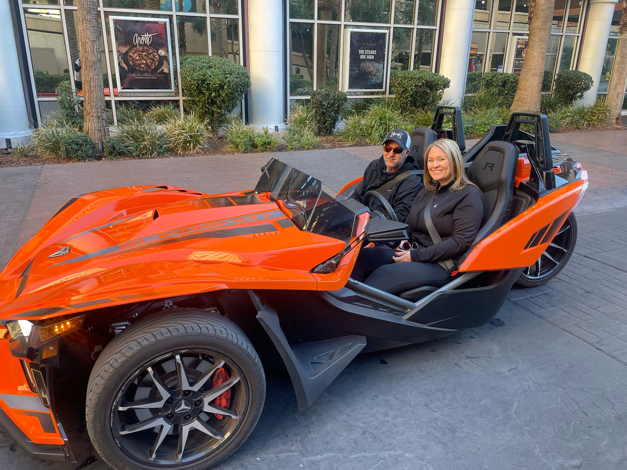 Couple in orange Slingshot at casino Las Vegas