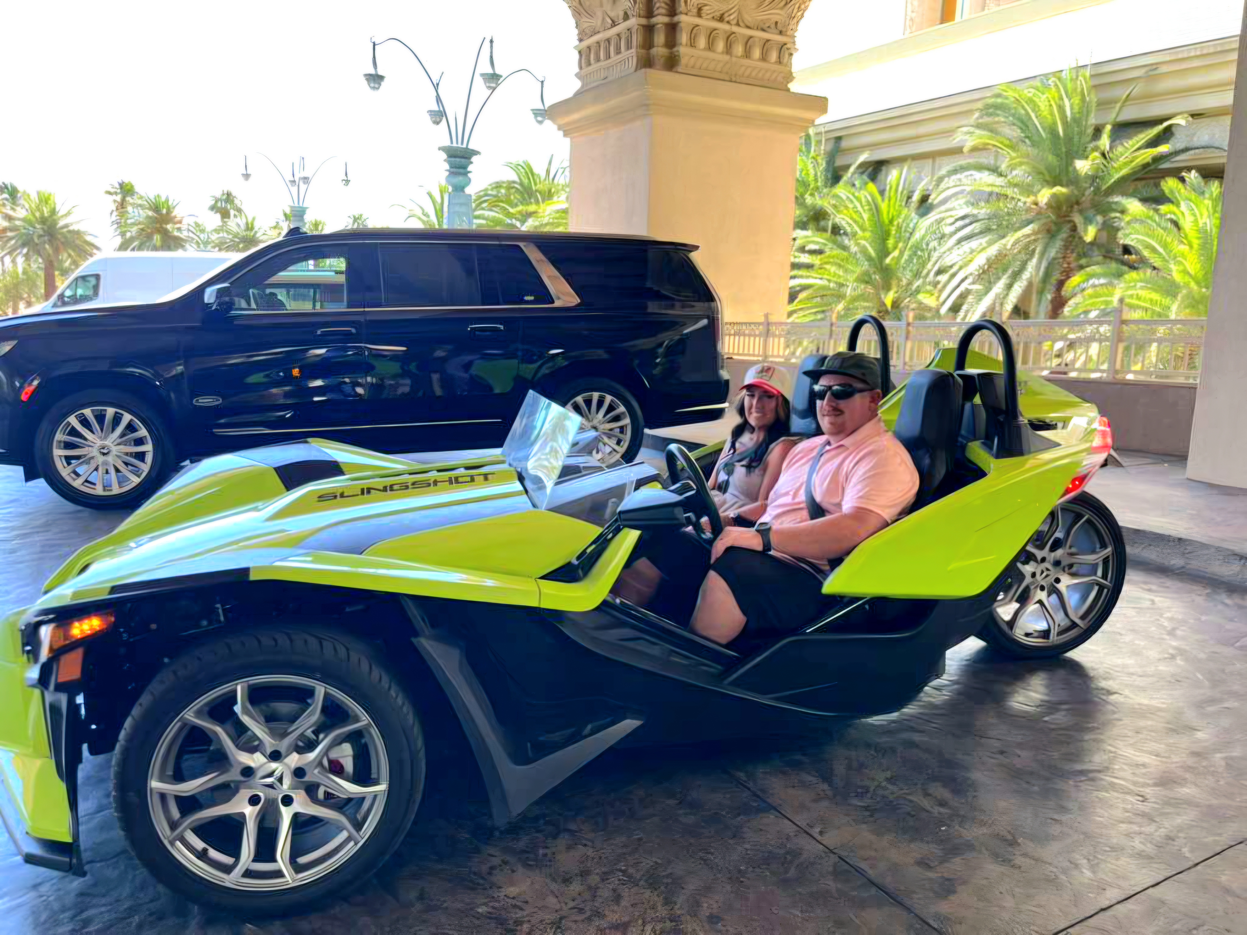 Couple in green Slingshot at casino entrance