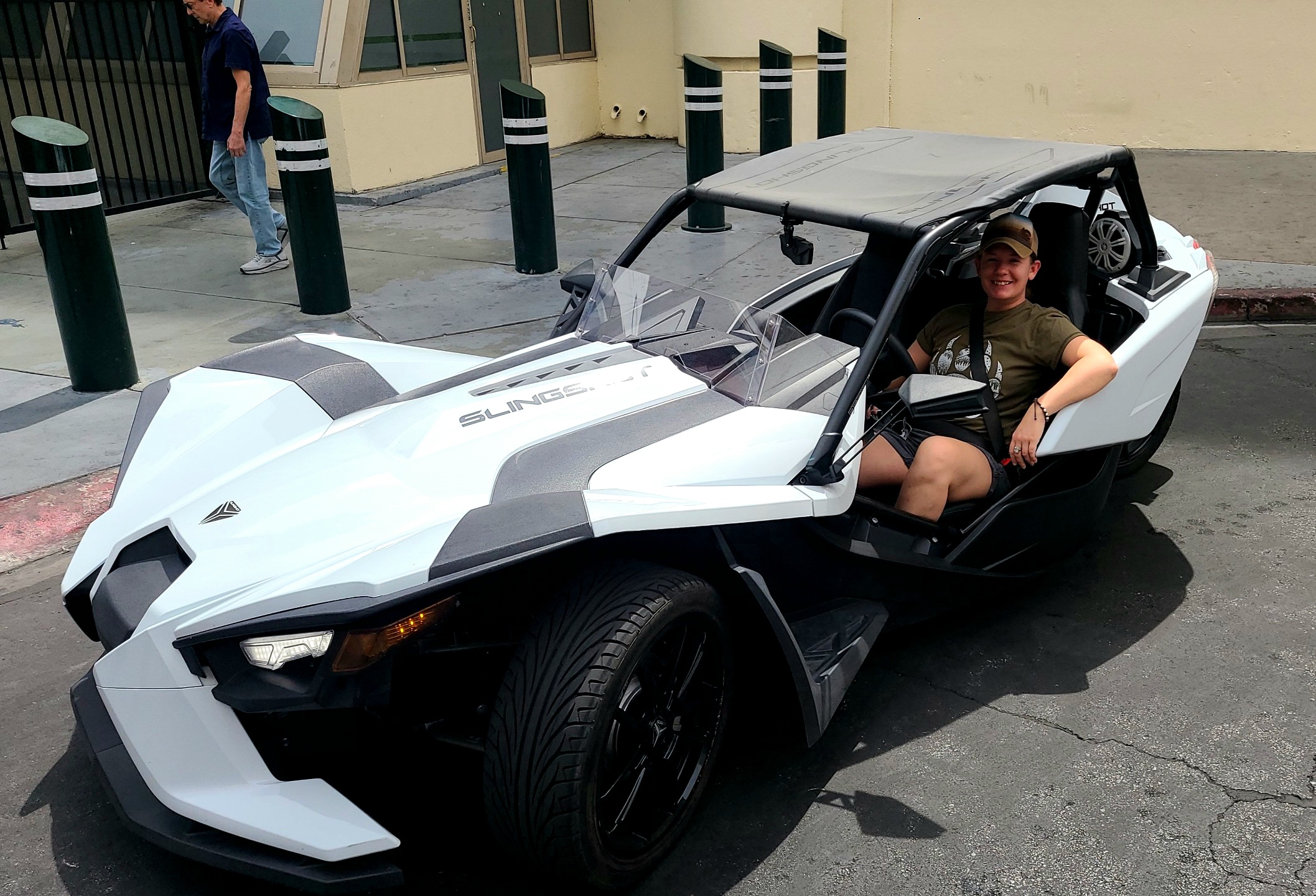 Customer in white Polaris Slingshot Las Vegas