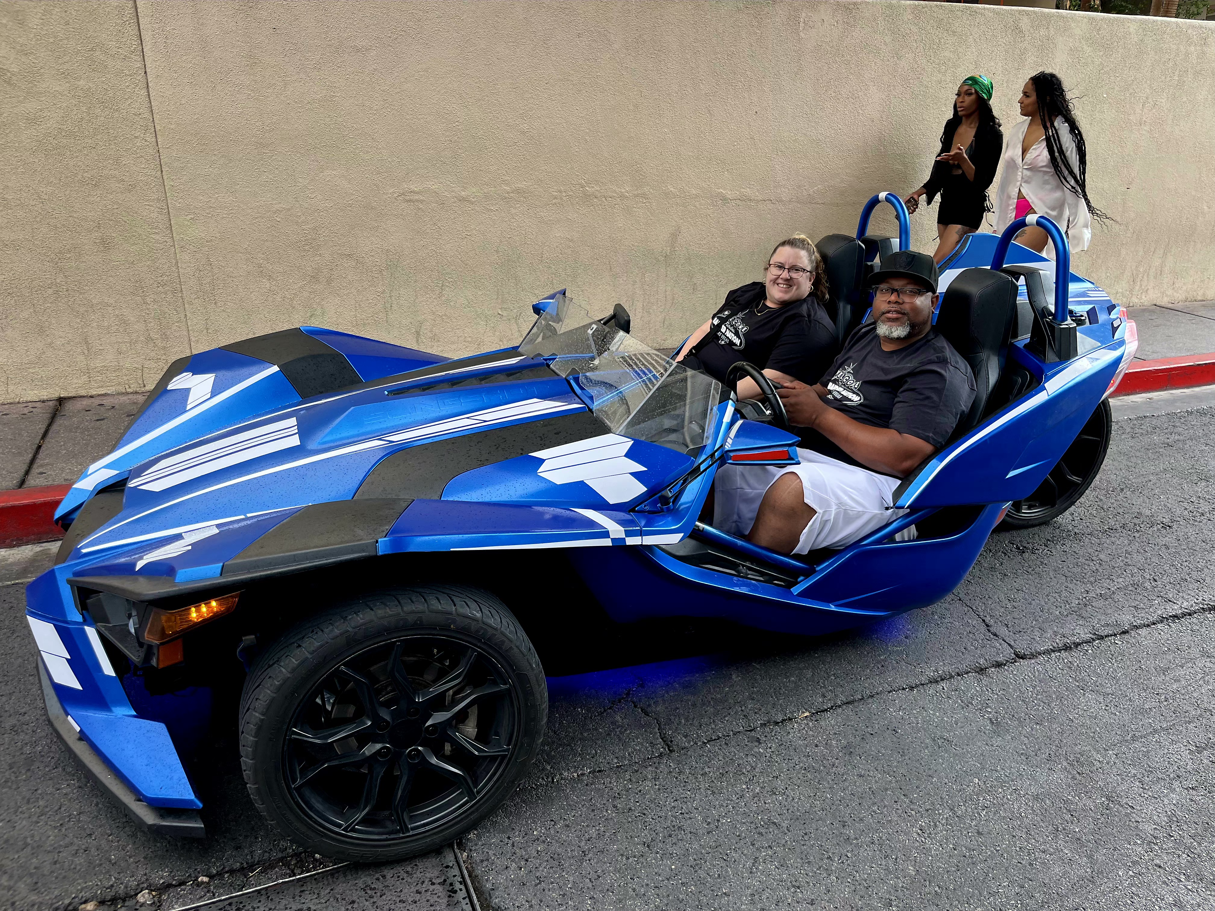 Couple in white Slingshot at Las Vegas convention center