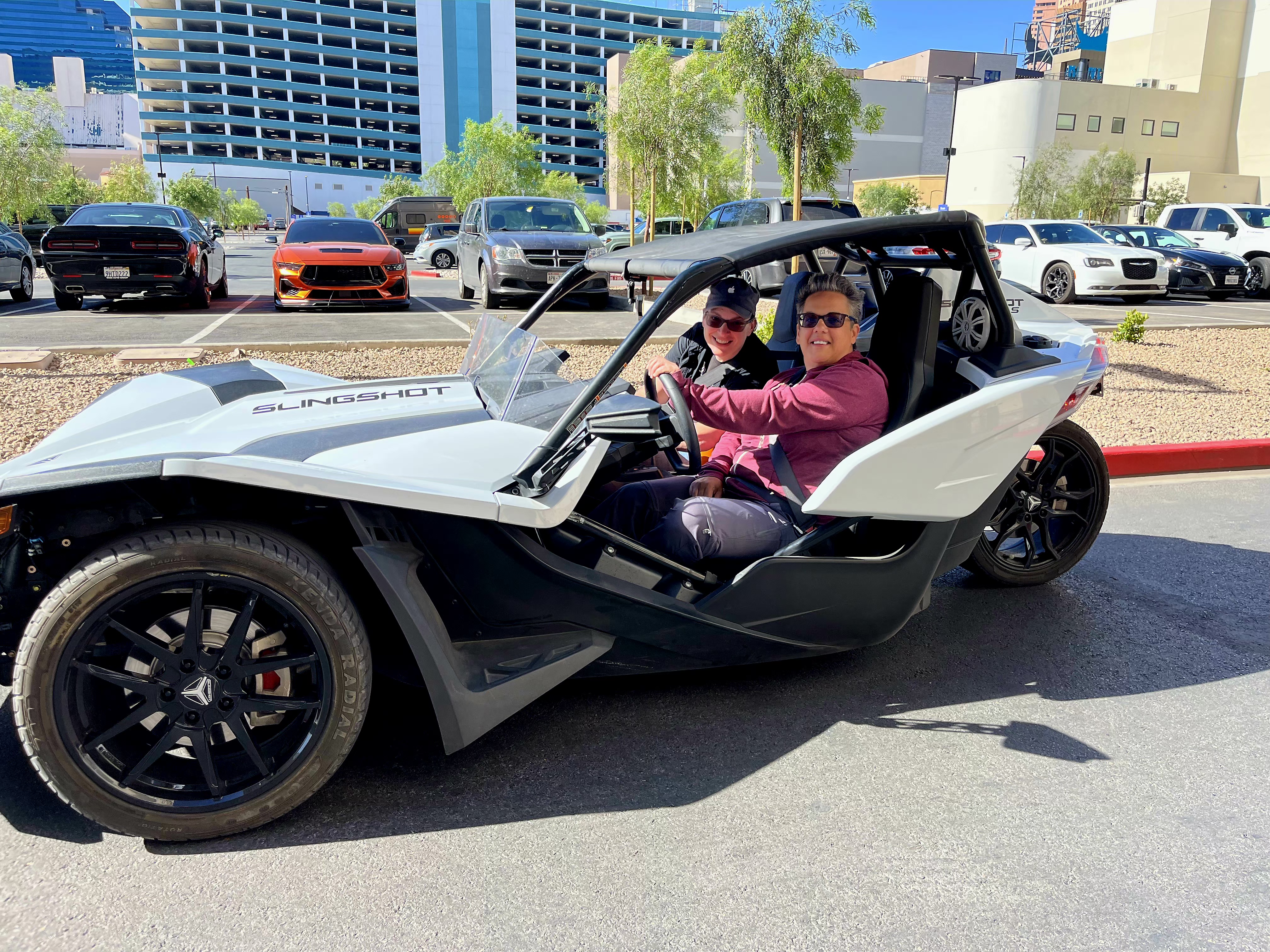 Two women in white Slingshot at Las Vegas hotel