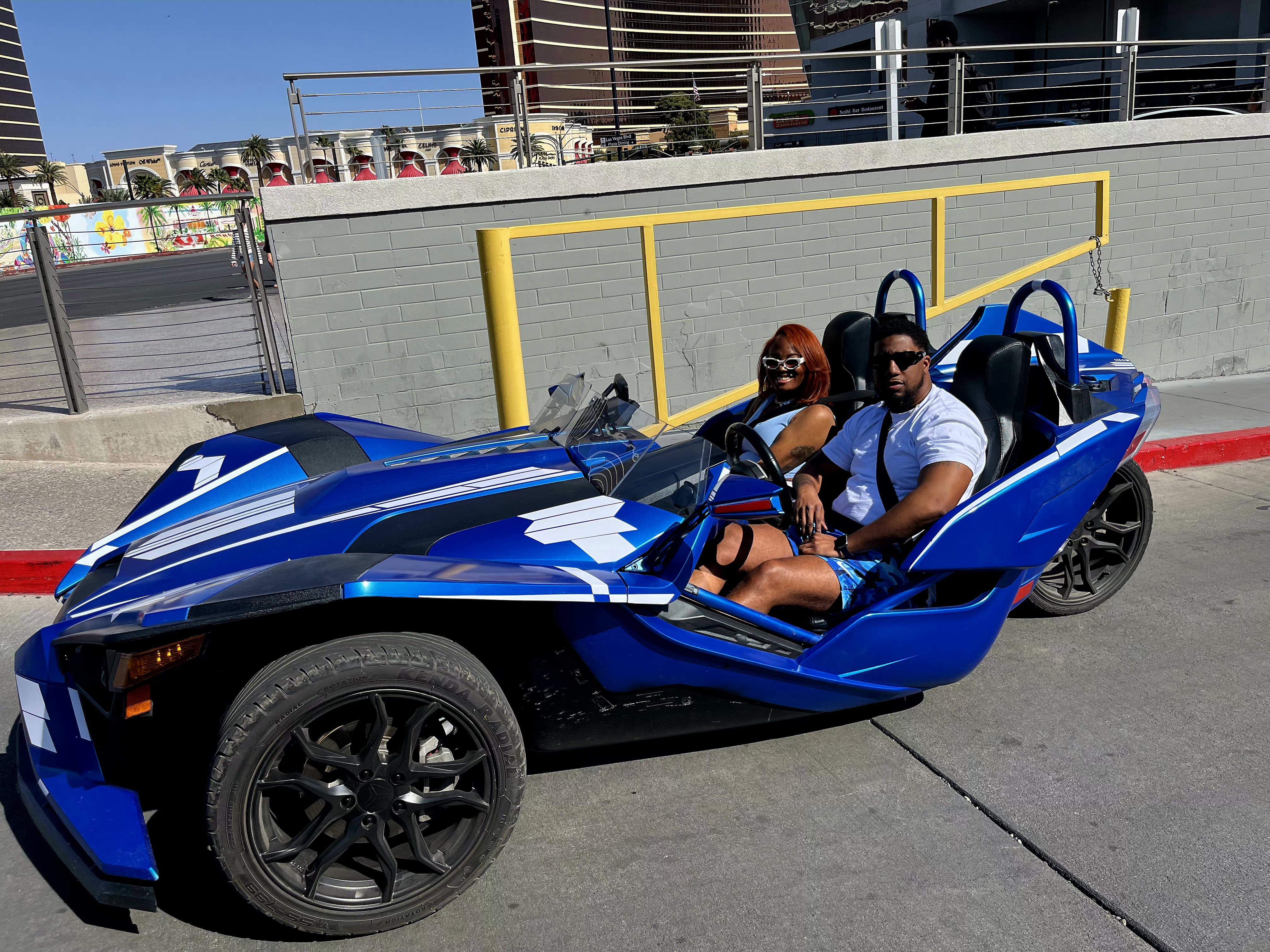 Couple in blue Slingshot on the Las Vegas Strip