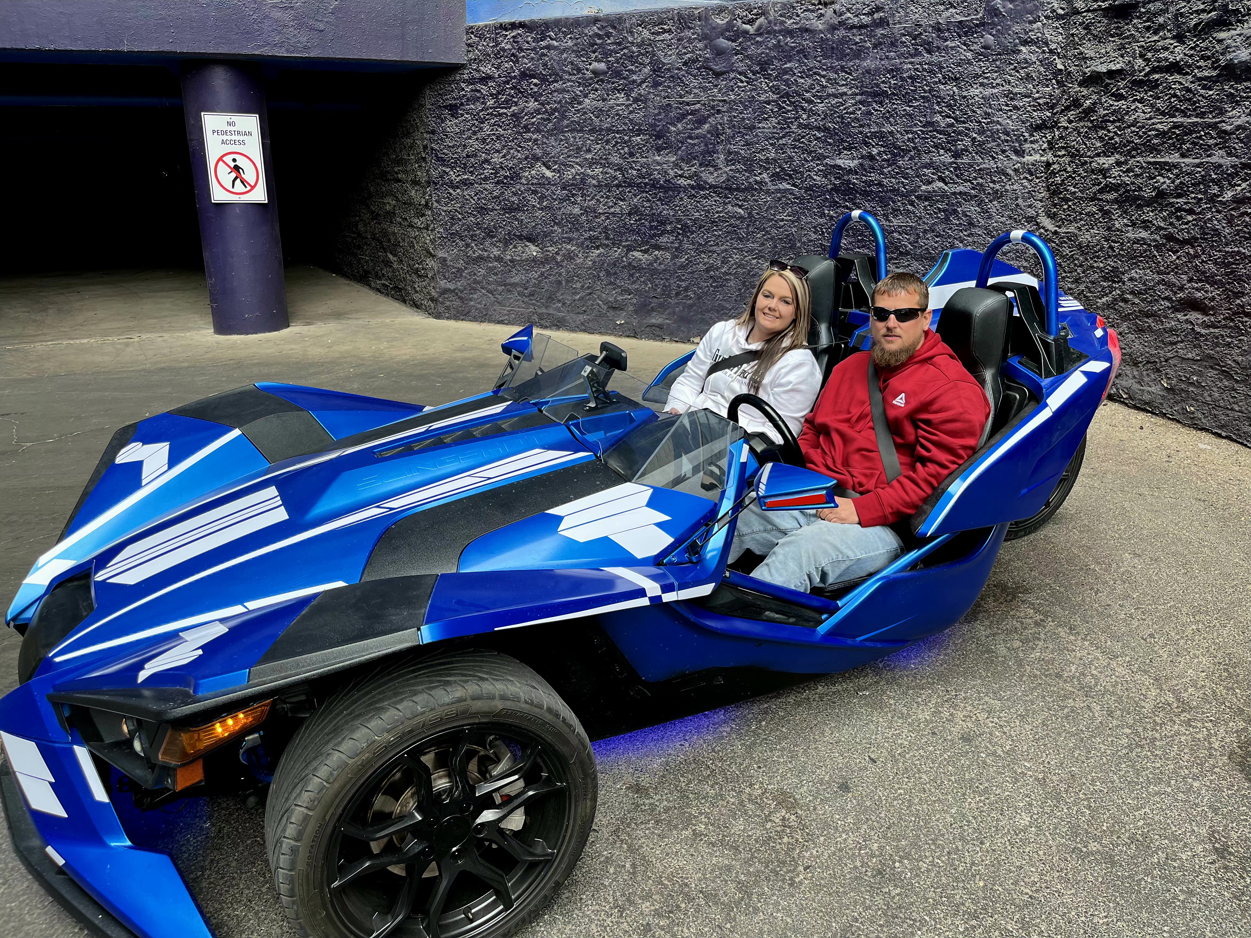 Couple in blue Slingshot with red Slingshot